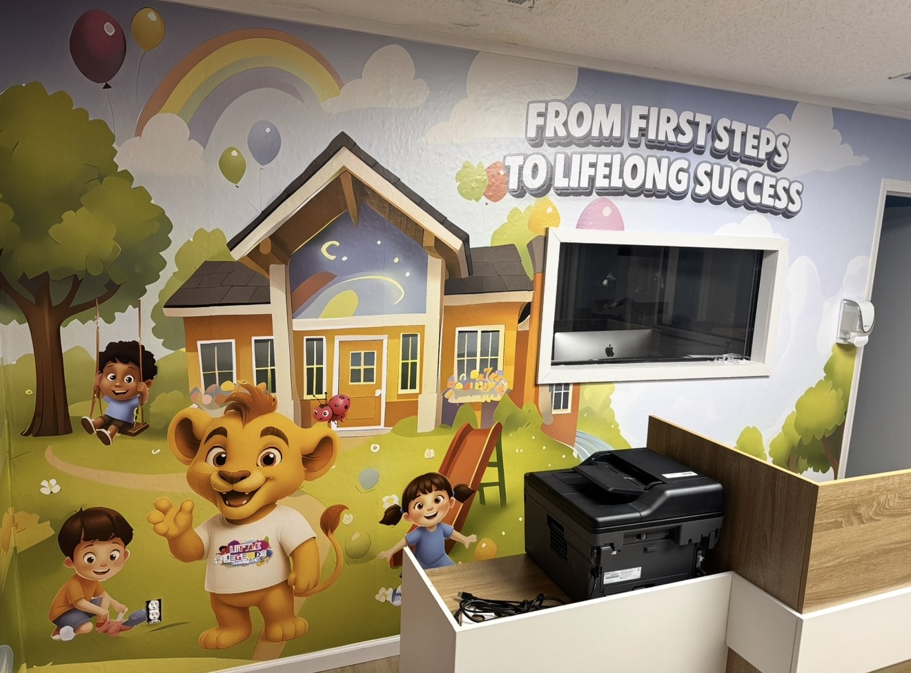 Little Legends Learning Loft lobby mural with Kash the lion cub